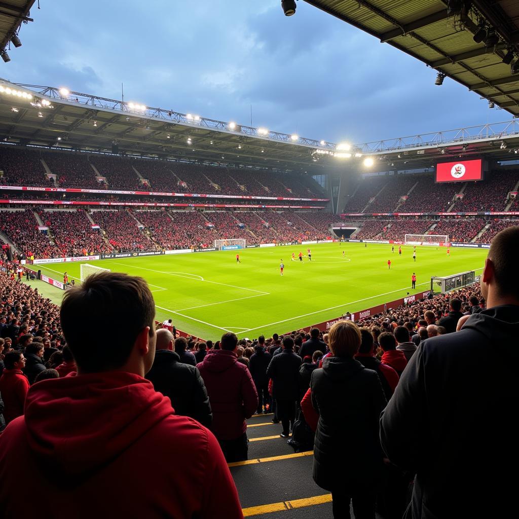 Hình ảnh khán đài St. Pauli Stadium chật kín khán giả trong một trận đấu quan trọng