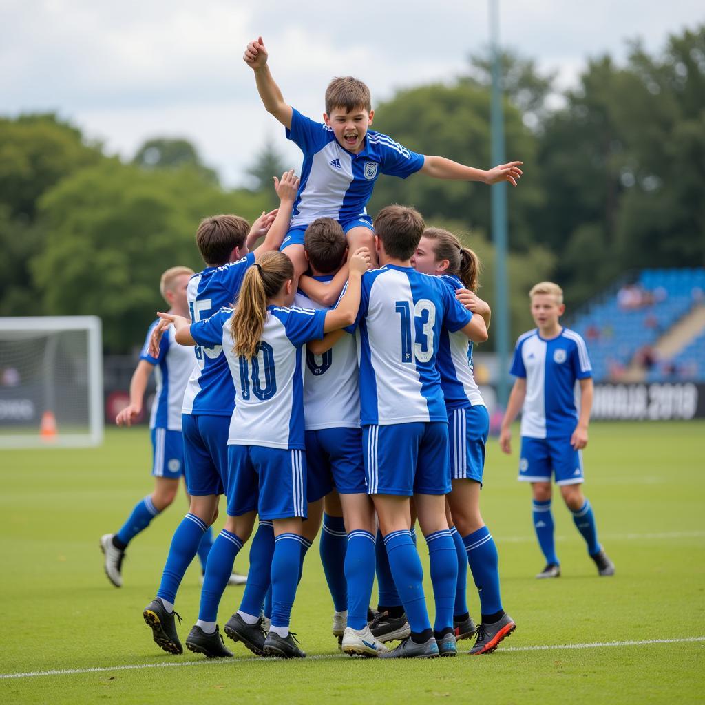 Lucas Tomlinson celebrates a goal with his team