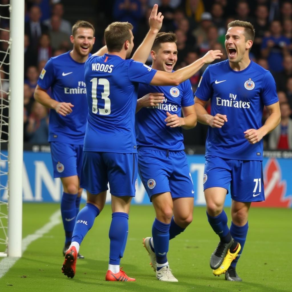 Sam Woods celebrates scoring a goal with teammates