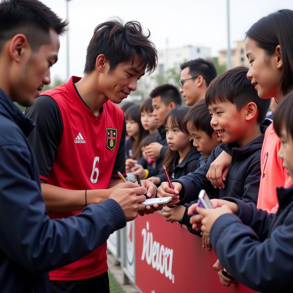 Lee Nguyen interacting with young fans