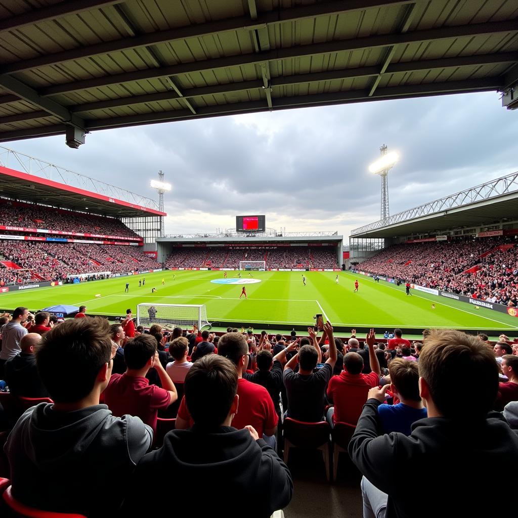 Khán đài sân Broadhurst Park Manchester chật kín khán giả.