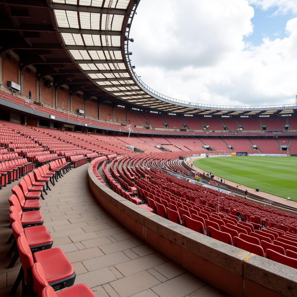 Kiến trúc cổ điển của sân vận động Estadio Bonfim, với tường gạch đỏ và mái che hình vòng cung.