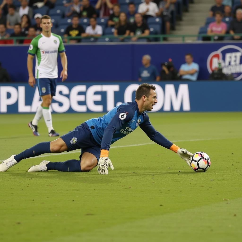Thủ môn Spencer Richey trong màu áo Seattle Sounders cản phá cú sút của đối phương.
